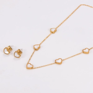 Detailed set of golden heart necklace and earrings featuring white mother of pearl inlay