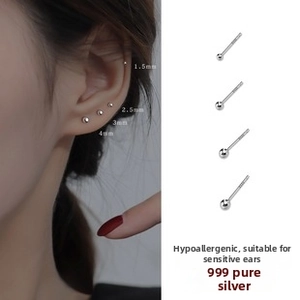 Detail of 999 sterling silver stud earrings in four sizes with model wearing shots