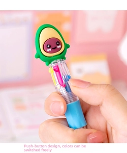 Close-up of cute cartoon avocado multi-color retractable ballpoint pen in hand
