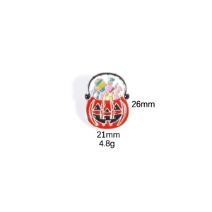Enamel Halloween pumpkin bucket brooch with candy details, size 26mm x 21mm