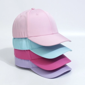 Close-up of four colored baseball caps in pink, sky blue, rose red and lilac purple