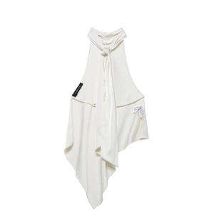 Detail view of cream satin halter top featuring a neck tie and asymmetric draped hemline