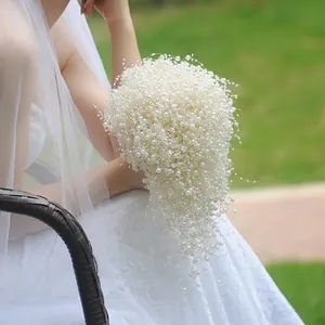 Exquisite bridal bouquet with white pearls and long beaded tassels for wedding decor