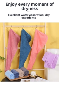 Macro view of multiple colored coral fleece hair drying towels with button closure