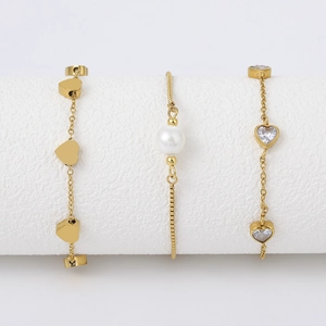 Set of three 18k gold plated titanium steel bracelets with heart and pearl details