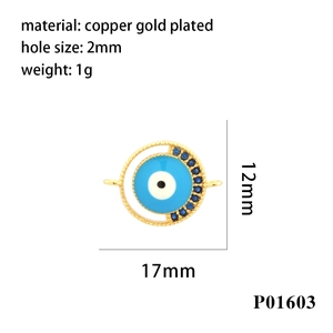 Macro detail of enamel evil eye connector in gold plated copper with 2mm holes