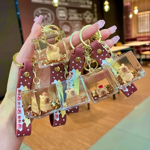 Creative Capybara liquid sand keychain with acrylic floaty charms and silicone wrist strap