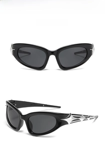 Detail view of black Y2K cat-eye sunglasses featuring silver star accents on the temple