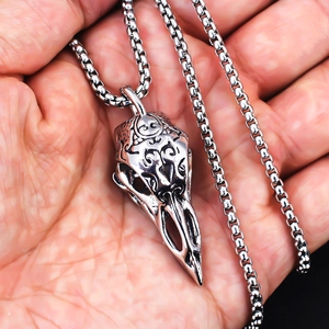 Viking stainless steel raven skull pendant with ornate engravings on a box chain