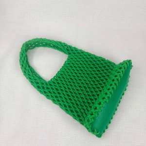 Detail of lime green woven mesh beach bag with reinforced synthetic leather bottom