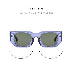 Detail of square purple translucent sunglasses frame with dark grey tinted lenses