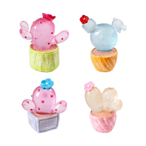 Mini luminous resin cactus figurines with translucent colorful finish on white background