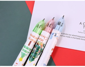 Macro shot of 6-color Christmas ballpoint pens with Santa and reindeer cartoon patterns