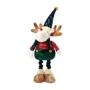 Plush Christmas reindeer doll in red sequin top and green suspender pants on white background