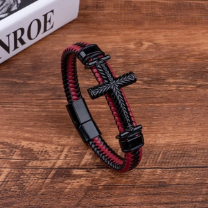 Close-up of red and black braided leather bracelet with black cross and magnetic clasp