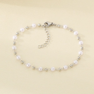 Detailed view of white pearls and silver beads bracelet with adjustable lobster clasp