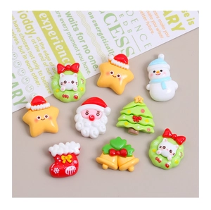 Detailed flat lay of colorful resin Christmas charms including Santa and cat wreath