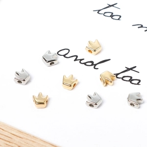 Golden and silver metal crown loose beads for DIY jewelry making on white card