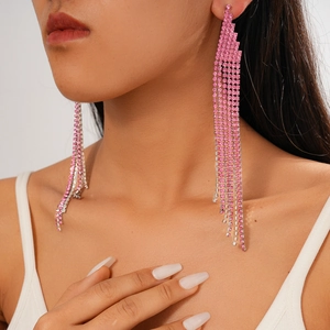 Close-up of pink rhinestone long tassel earrings showing crystal fringe detail on model