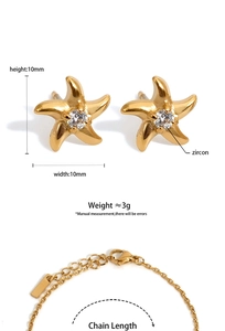 Detail view of starfish earrings and bracelet set with zircon stones and size dimensions