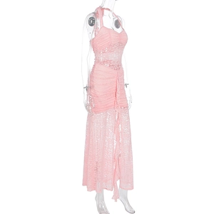 Detail of pink lace halter dress showing intricate crochet texture and ruched waistline
