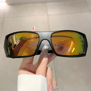 Close-up of futuristic cycling sunglasses with orange mirrored lenses and black frame