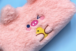 Close-up of pink plush stationery bag featuring cute pig and duck embroidery details