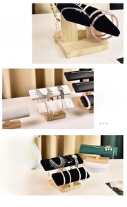 Detailed view of solid wood jewelry display stand with soft velvet and leather padding