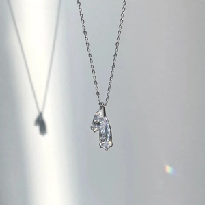Detail of S925 sterling silver necklace with double pear-cut teardrop zircon pendants