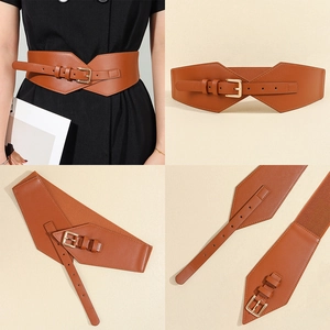 Detail view of brown wide belt with gold buckle and elastic back for women