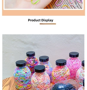 Detailed macro view of colorful high-elastic hair ties in transparent storage jars