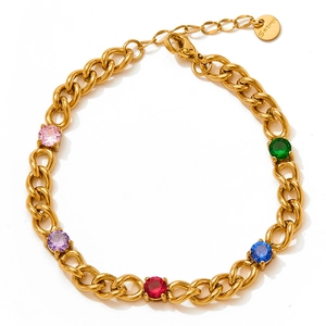 Gold stainless steel Cuban bracelet with colorful zircon stones on white background