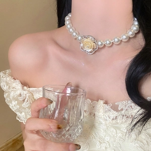Multi-layer pearl necklace featuring a diamond-encrusted resin rose flower pendant