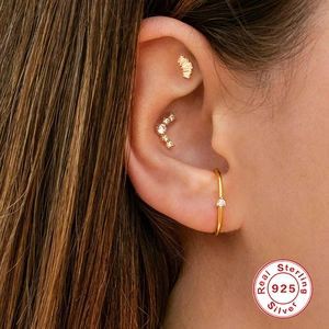 Minimalist S925 sterling silver gold V-shaped ear studs set worn by female model