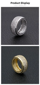 Detail of gold and silver iced out hip hop rings with micro paved cubic zirconia