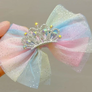 Rainbow gradient mesh hair bow clip for girls featuring a sparkling rhinestone crown