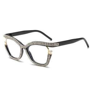 Stylish cat eye glasses for women featuring pearl and rhinestone accents on a black frame