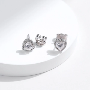 Sparkling S925 sterling silver heart-shaped moissanite stud earrings on a clean white stand