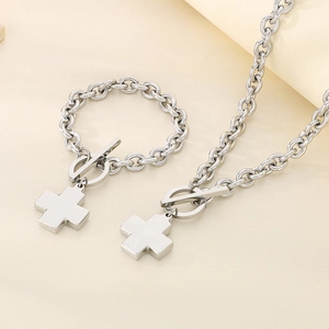 Polished stainless steel jewelry set featuring chunky chain links, OT toggle, and cross charm