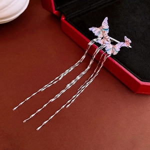 Detail showing the purple and pink gradient butterfly earrings with long silver tassels