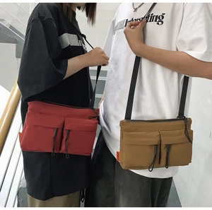 Male and female models wearing casual nylon messenger bags in red and khaki colors