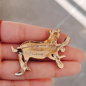 Golden leopard brooch with textured back detail and stainless steel pin closure