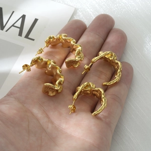 Lava-style irregular gold-plated stainless steel earrings with wavy fluid texture