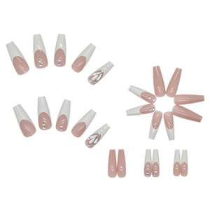 Long coffin press on nails with nude pink base, white French tips and silver rhinestones