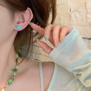Blue crystal flower stud earrings with green beaded necklace set on model