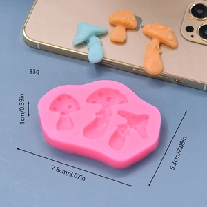 Pink silicone mushroom mold for fondant and clay with 3 cavities and size measurements