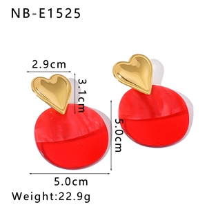 Detailed view of chunky heart and red resin circle drop earrings with size measurements