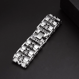 Punk style stainless steel skull bracelet for men in silver finish on black background