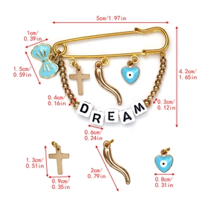 Detailed size specifications for the gold pin brooch with blue charms and DREAM letters
