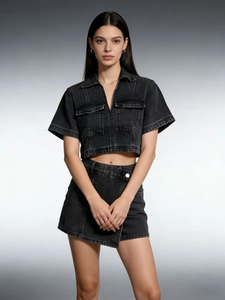 Detail of grey washed denim set with V-neck short sleeve top and asymmetric skort